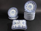 a set of six blue and white plates with blue and white designs