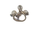a close up of a ring with pearls on a white background