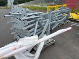 a large pile of metal beams on a cart