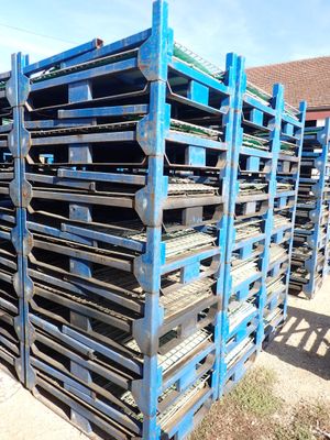 a lot of pallets that are stacked up on the ground