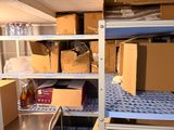 a room with a lot of boxes and boxes on the shelves