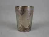 an image of a silver cup with a diamond design on it
