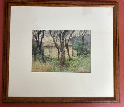 photo encadrée représentant une maison dans les bois