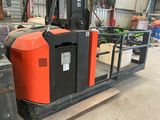 a forklift truck that is parked in a warehouse