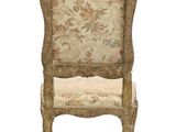 an image of a chair with a floral upholstered back and seat