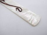 an image of a long piece of mother of pearl with a snake on it ' s back
