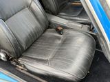 an image of a car seat with a remote control in it