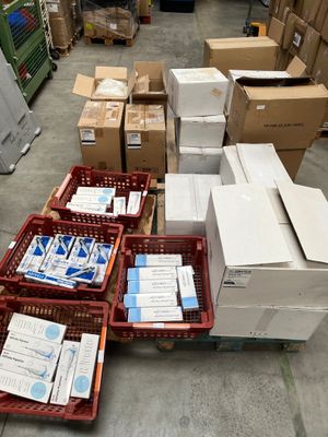 several boxes of mail are stacked on top of each other in a warehouse