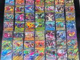 a large collection of pokemon cards are displayed on a table