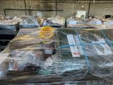 many boxes of food wrapped in plastic on a table