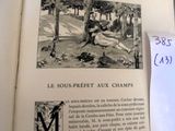 an open book with a picture of a man laying on the ground