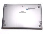 a laptop that is sitting on a white surface