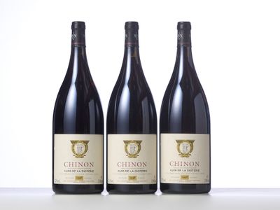 three bottles of wine sitting on top of a table next to each other