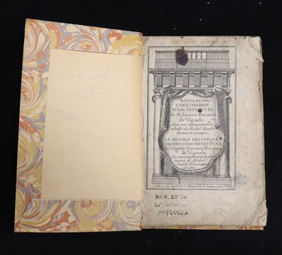 an open book with a drawing of a building on it