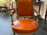 a chair that is sitting in the middle of a room