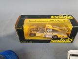 a box with a toy car in it on a table