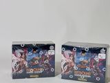 Deux boîtes de cartes à collectionner Pokémon sont posées sur une surface blanche.