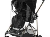 an image of a stroller with a rain cover on it