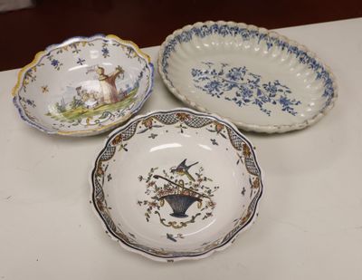 three plates with different designs on them sitting on a table