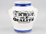a white and blue vase with black writing on it