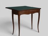 a small table with a green top and wooden legs