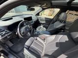a view of the inside of a car from the driver ' s seat