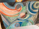 a picture of a painting on a easel in a room