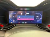 an image of a car dashboard with a digital display