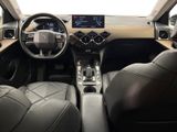 the interior of a car with leather seats and steering controls