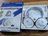 packaging of a pair of headphones in a box on a wooden table