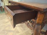 a wooden desk with a drawer underneath it