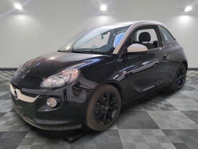 a picture of a small black car on a checkered floor