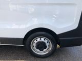 a white van that is parked in a parking lot