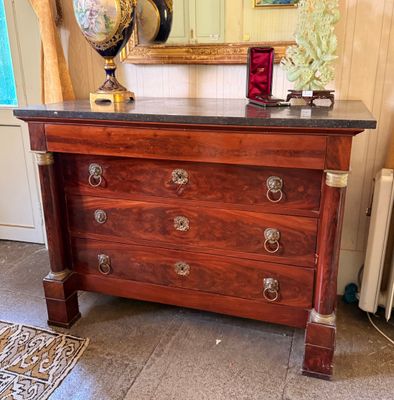 a dresser with a globe on top of it