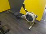 a rowing machine in the corner of a room
