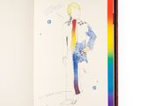 un livre ouvert sur lequel figure le dessin d'un homme en costume-cravate