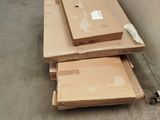 several cardboard boxes are stacked on top of each other in a warehouse