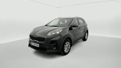 a black car is parked in a white room