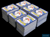 a lot of pokemon cards stacked on top of each other