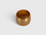 a close up of a gold ring on a white surface