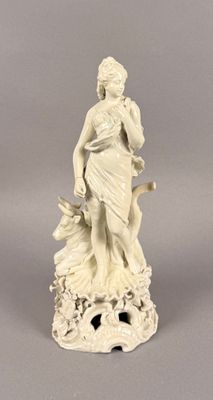 statue of a woman with a bird on her shoulder