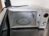 a microwave that is sitting on a table