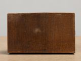 a small wooden block sitting on a table