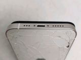 a close up of a broken cell phone on a table