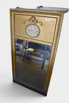 a mirror with a gold frame and a mirror with a clock on it