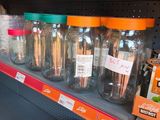 many jars and pans on the shelves in the store