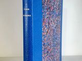 an image of a blue book sitting on top of a white table