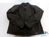 black leather jacket on a white background with a blue label