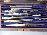 many different types of metal tools in a case