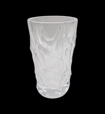 a glass cup that is sitting on a table